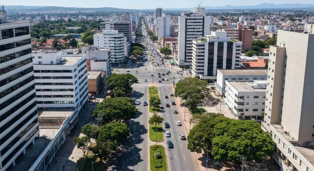 Vista aérea moderna de Águas Claras, DF, com prédios, ruas planejadas e pôr do sol